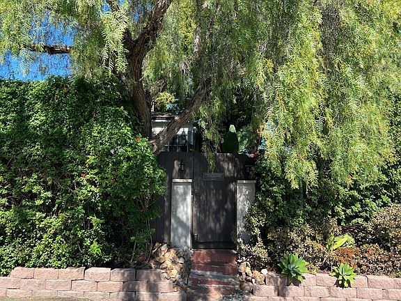 View of front gate from W. Lewis St.