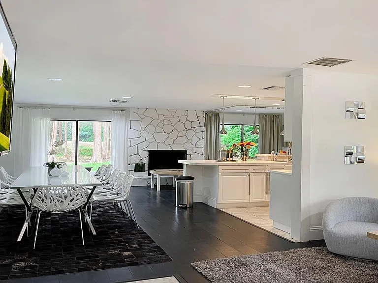 Living room with 70-inch smart TV with cable TV.