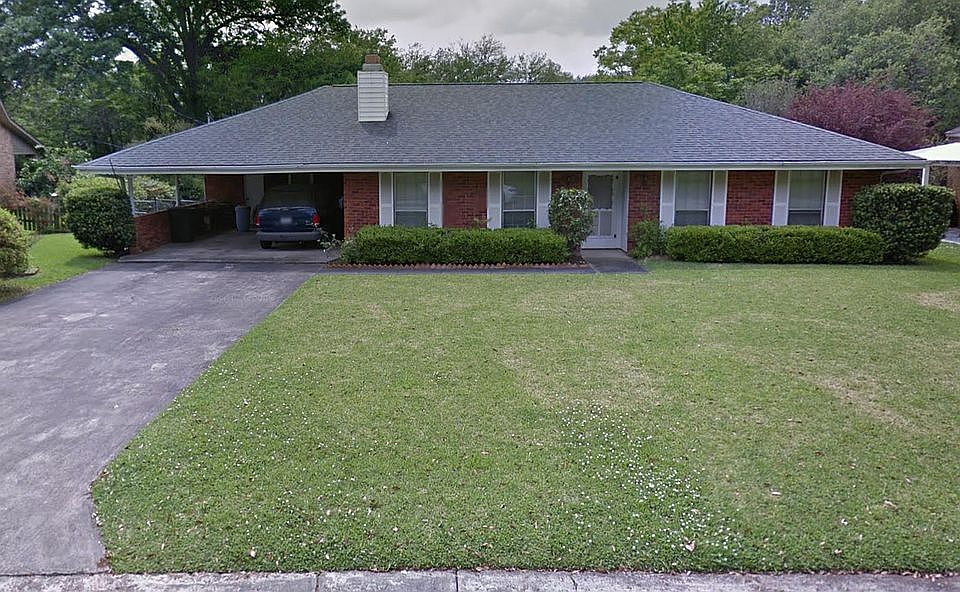 This property has a large front yard and an even larger backyard.
