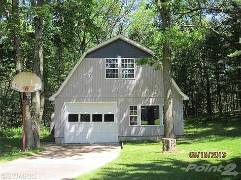 Paved entrance to Garage. Fits 2 cars, lots of storage and loft area.