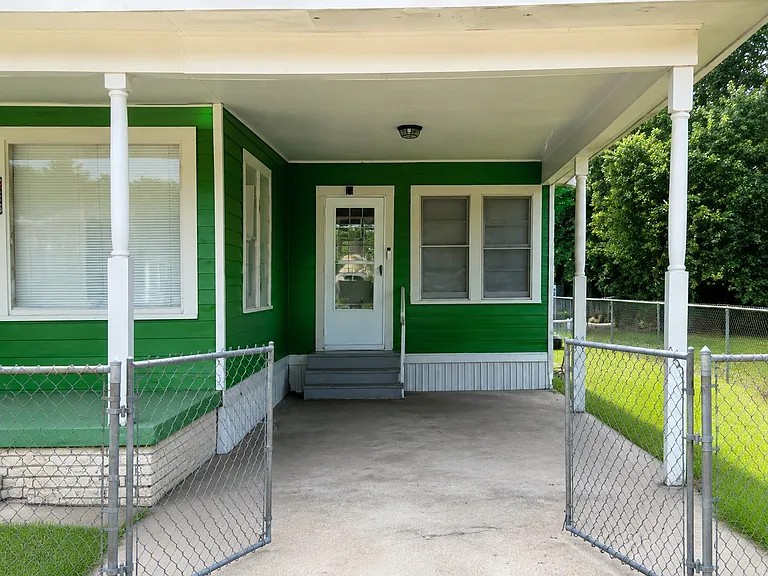 Covered Carport & Private Entrance offering protected parking and convenient access to the home.
