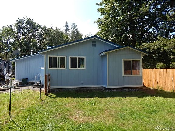 Rear view of home. Backyard is fully fenced! 