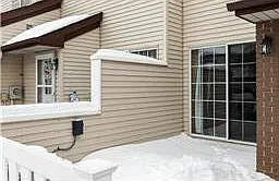 Stone Patio with door to Living Room.
