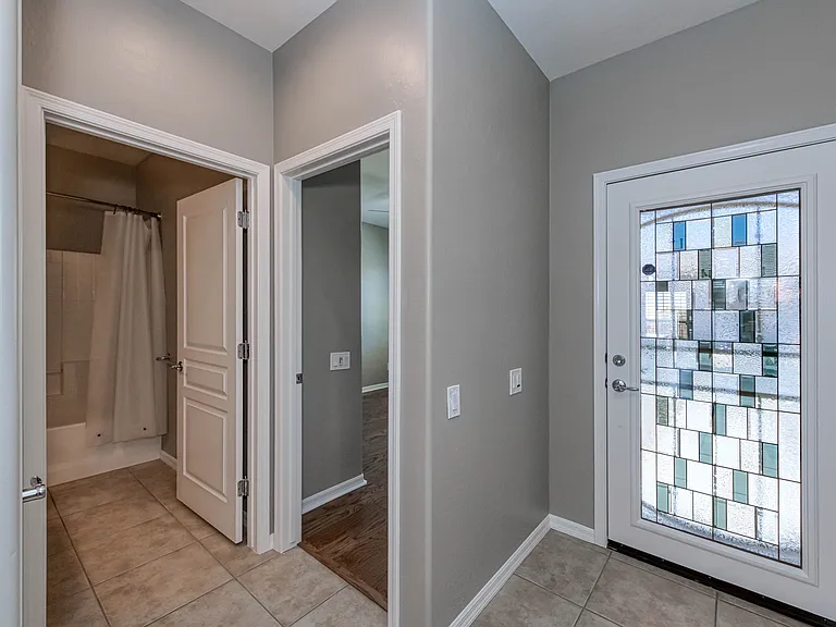 Custom entry door allowing for natural light.