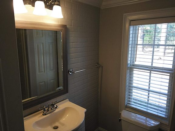 Bathroom area, full sized tub with shower feature only.