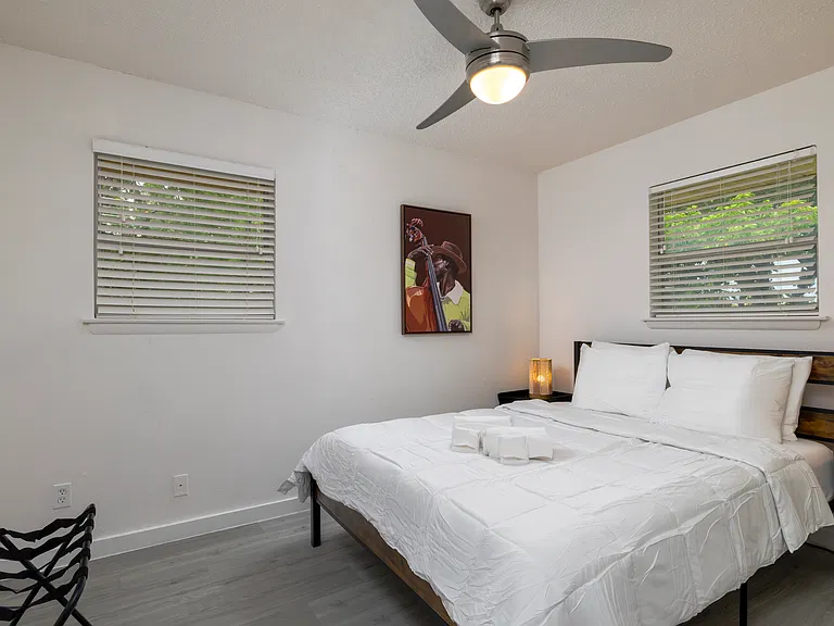Bedroom #1 with attached full bath and queen bed.