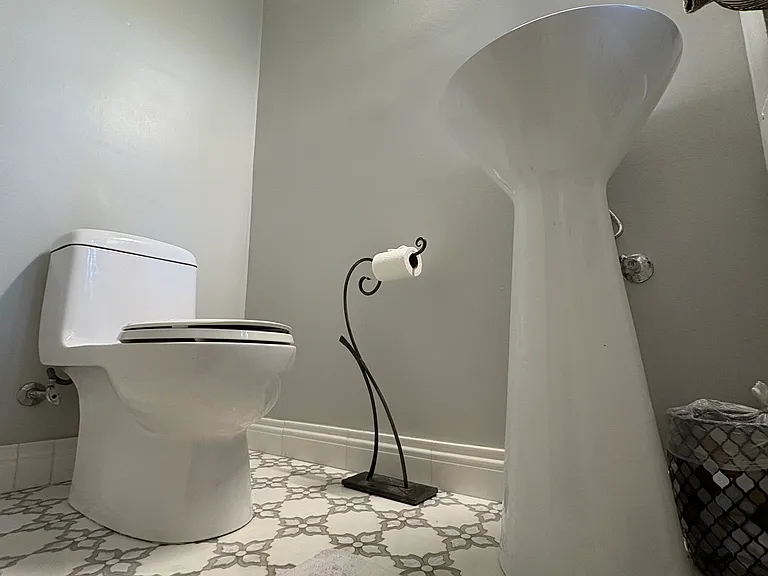 Powder room on first floor, with mosaic mother of pearl and thassos marble tile