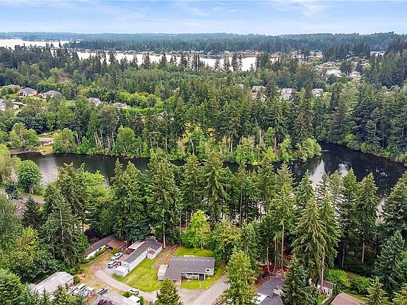 Best of Both Lakes! Enjoy the view of Bowman Lake from the privacy of your backyard everyday or just 1 short block away from Lake Tapps Park amenities. Enjoy boating, picnicking, swimming, or just relaxing on the beach!
