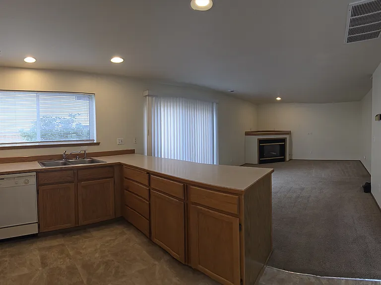 open layout kitchen and living room. with dining area and laundry area to the right of this picture.