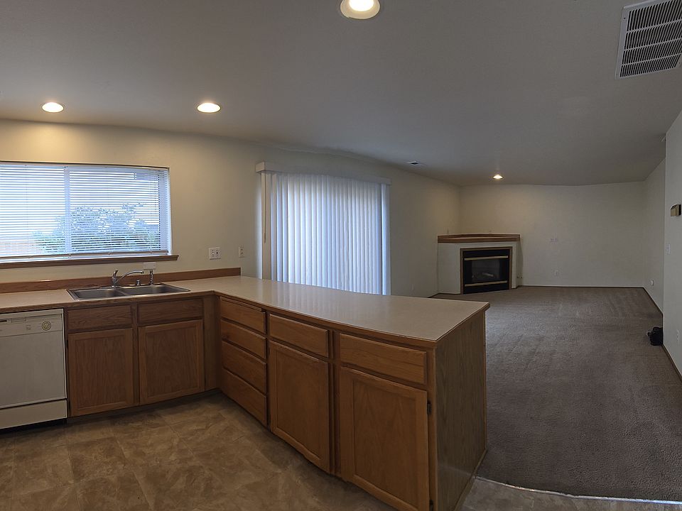 open layout kitchen and living room. with dining area and laundry area to the right of this picture.