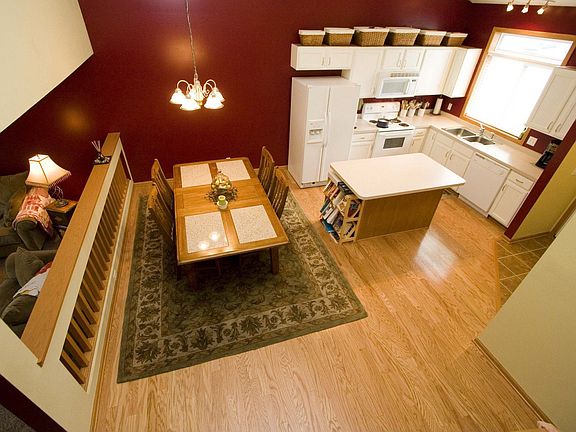 Open and spacious floor plan, new wood floors/stove/counters/tile entry.