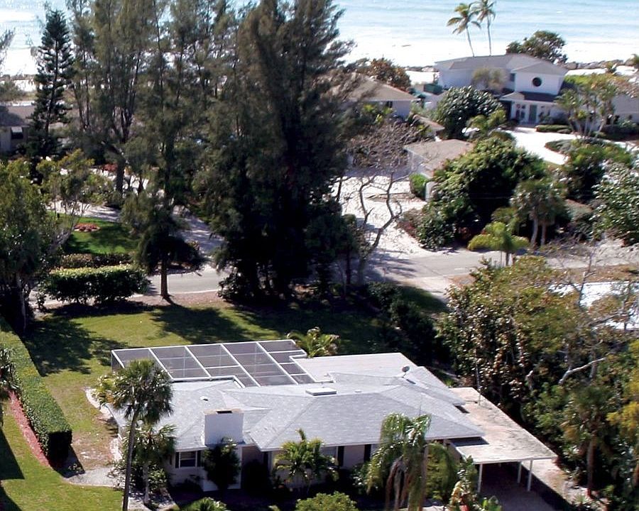 Adorable cottage surrounded by multimillion dollar homes!