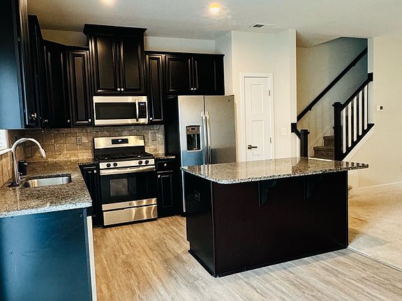 Gourmet Kitchen with Stainless Steel Appliances and Granite Countertops