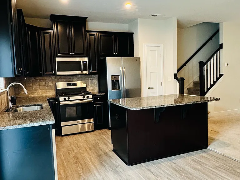 Gourmet Kitchen with Stainless Steel Appliances and Granite Countertops