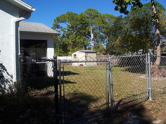 yard is secure with a chain link fence surronding the entire
