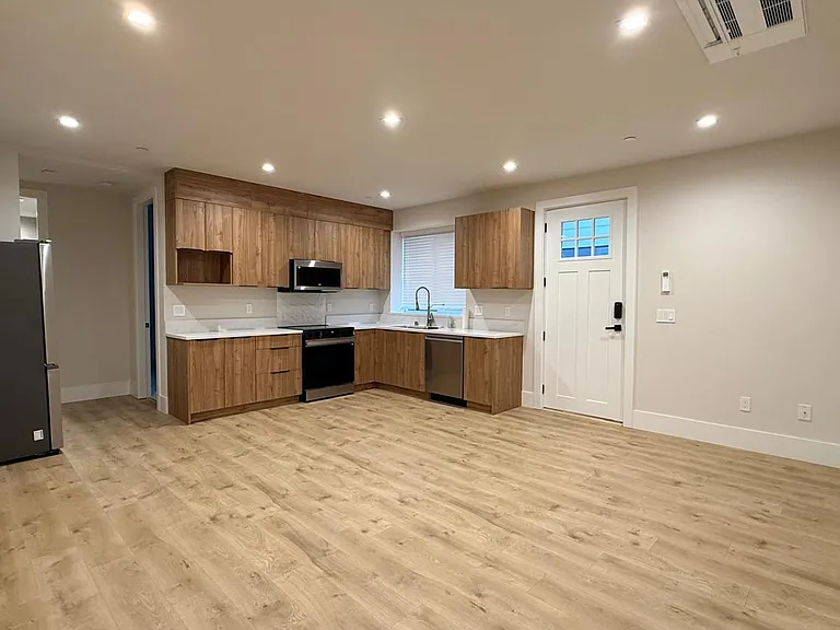 Spacious living with an Open kitchen with smart stainless-steel appliances