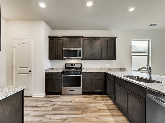 The spacious kitchen is perfect for preparing your family s favorite meals and treats.