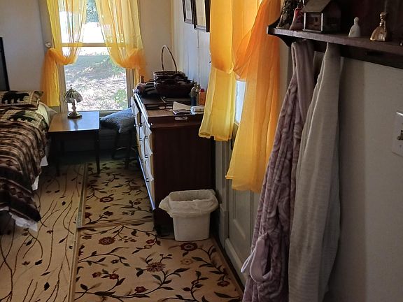 Entrance to front bedroom from livingroom with door to outside back yard.