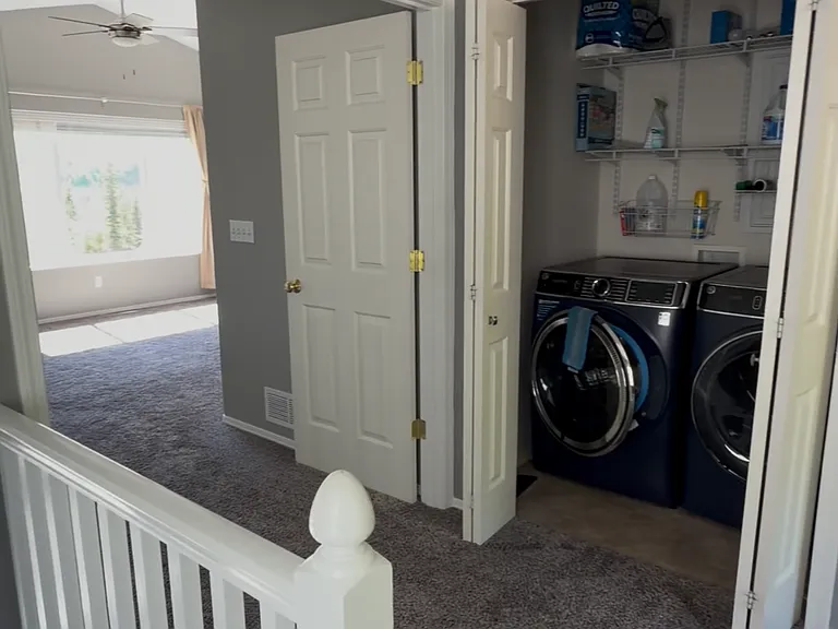 Laundry room at the top of the stairs and master bedroom entrance
