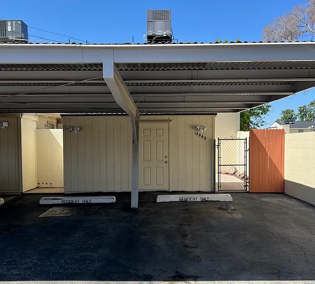Rental Premises Carport Covered Parking Spaces #1 after Power Wash, Resealing, Premises Shed, Patio Gate Entry, (2) New Motion Activated Security Lights.