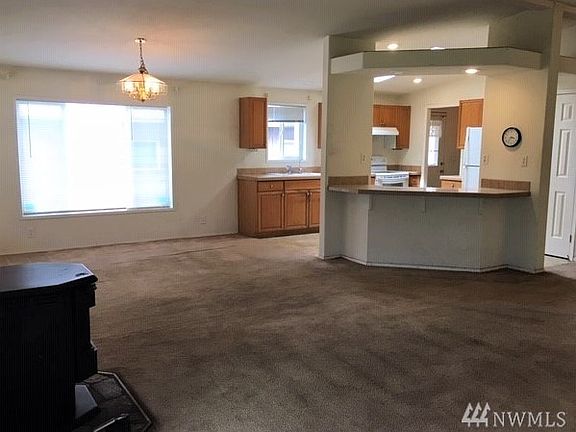 No need to feel left out of family activities when preparing meals. Kitchen island open to living space.