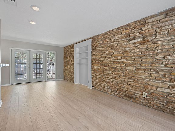 Entering Unit A you're greeted by a stacked stone feature wall