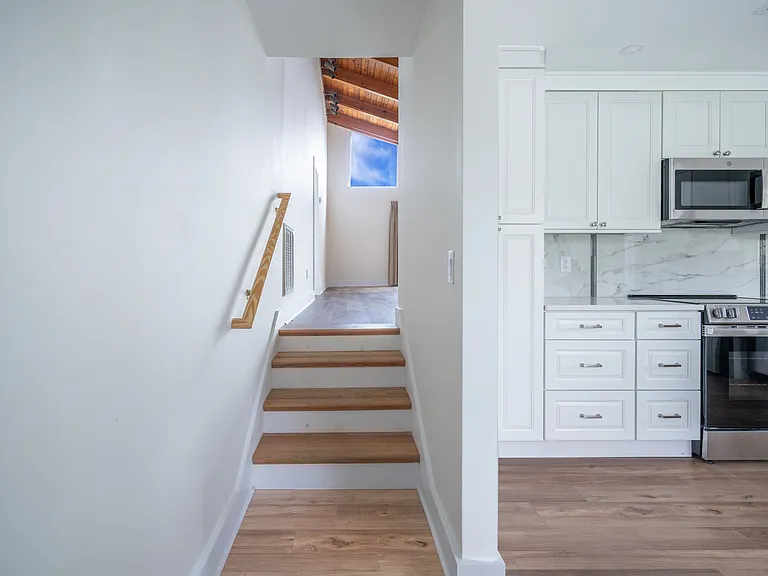Stairs from kitchen to living area