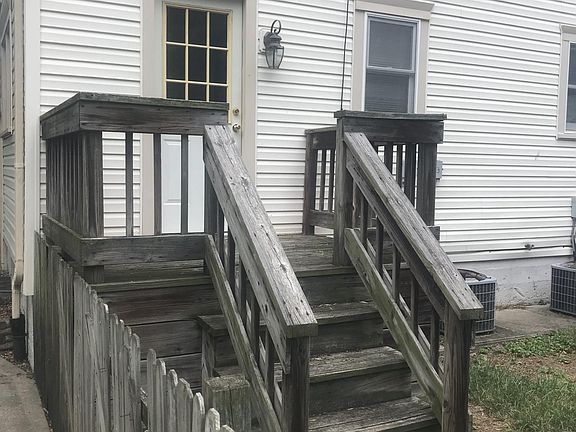 Back entrance to the property with a small dick