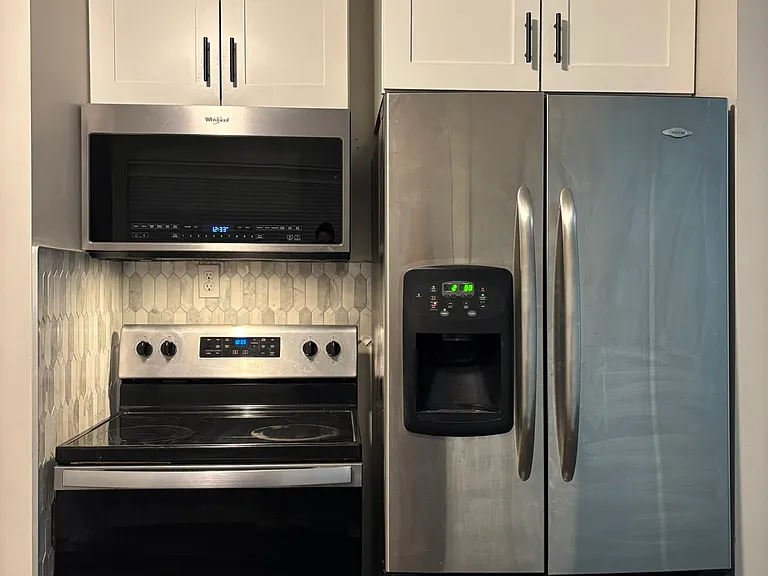 Modern stainless steel microwave, oven and refrigerator come with the rental!