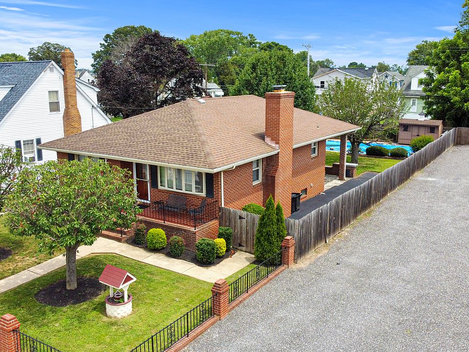 Stunning renovated 3BD/2BA brick rancher w/2 levels, in-ground pool, shed, privacy fencing, gleaming hardwood floors, 2 Spa-Style full baths w/large walk-in showers, sunroom, family rm with cozy fireplace, built-ins, laundry, & more!