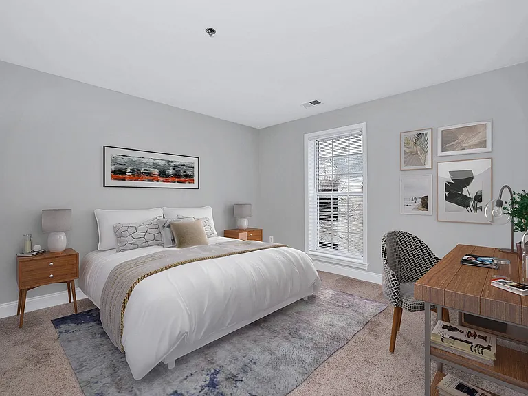 Spacious bedroom with plush carpeting