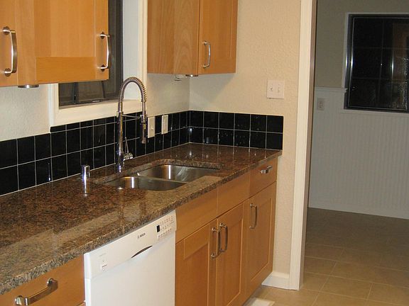 Partial kitchen and laundry area