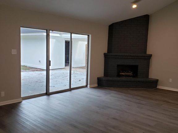 Sliding glass door out to the newly poured patio.