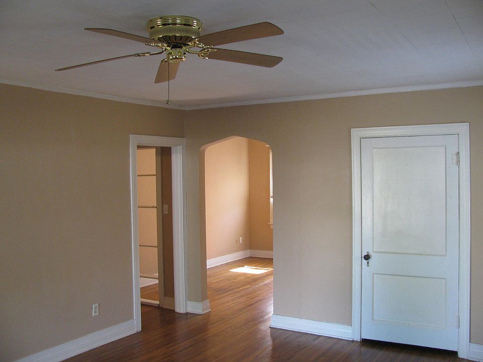 Living room looking through arch to dining room/study