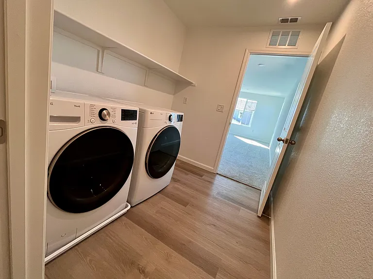 Laundry room with brand new washer-dryer