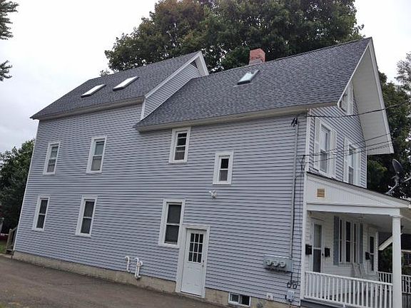 This unit occupies entire dormered third floor.