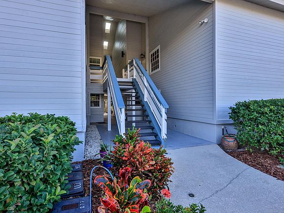 The exterior stairs leading to the condo on the right hand side.