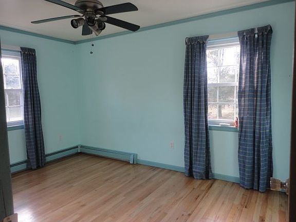 2nd Bedroom with Wood Floors and Ceiling Fan
