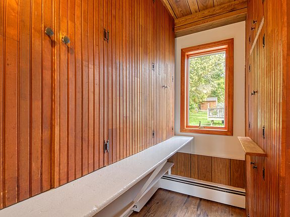 Huge pantry lined with floor to ceiling cabinetry.