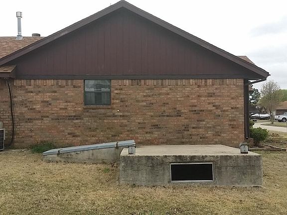 Side of house and storm shelter