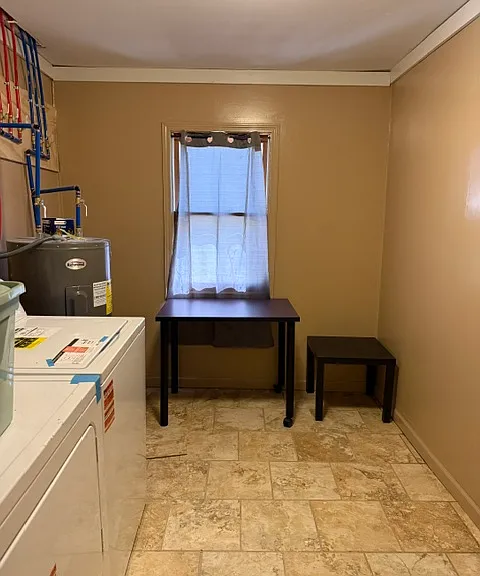Fully redone laundry room with new washer, dryer and water heater.