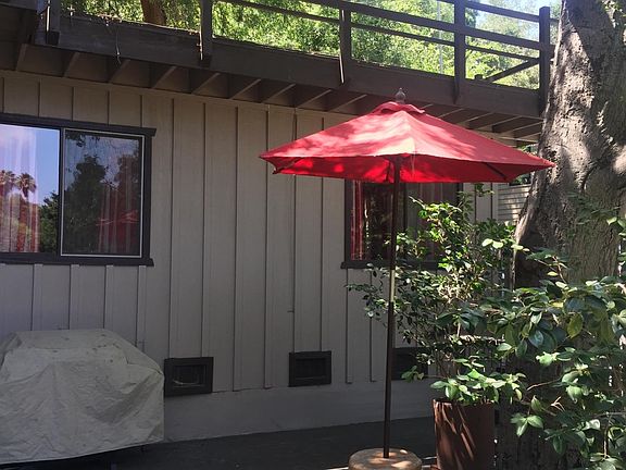 Main deck, included umbrella and barbecue. Partial display of panorama pic. Rooftop deck above