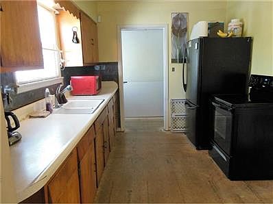 The kitchen does need an overhaul.  But seller is providing everything you need.   Stove and refrigerator are only 3 years old, and will remain with the home.