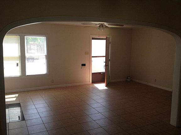 Standing in dining room looking toward front door.