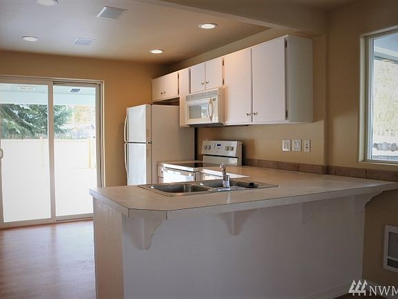 Updated kitchen with new range and dishwasher. Refrigerator included!