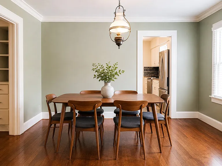 Open dining space with vintage light fixture to encapsulate the charm of the 1920's.