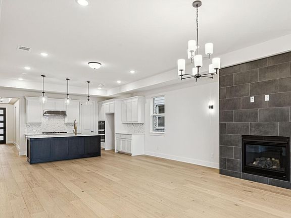 Spacious great room adjacent to the casual dining area and kitchen