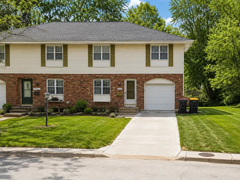 7031 NW Chapel Woods Ln — Photo 1