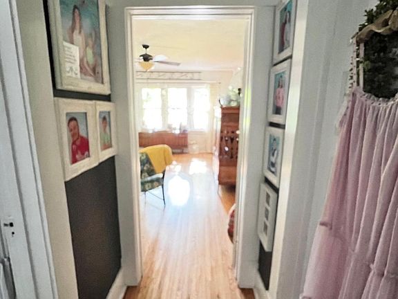 Hallway to bath on left and Master on right