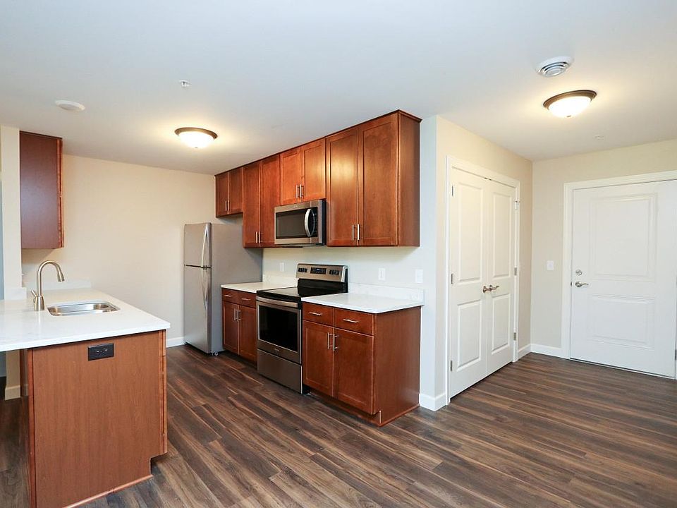 Kitchen features quartz countertops, soft close drawers and stainless steel appliances